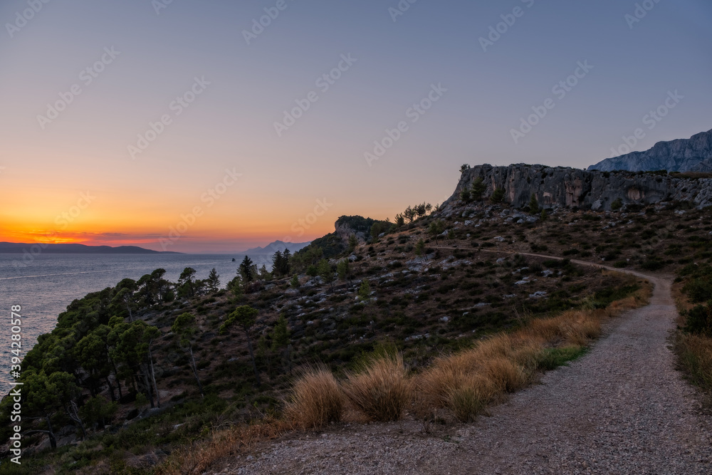 Sunset view from Biokovo montains, the second-highest mountain range in Croatia, located along the Dalmatian coast of the Adriatic Sea. August 2020