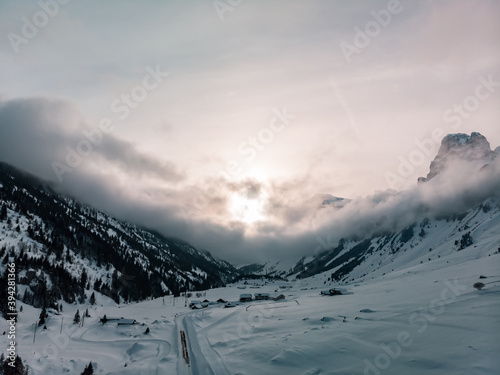 Klausenpass, Canton Uri, Switzerland: Aerial image of a beautiful sunset during winter with interesting could formations.
