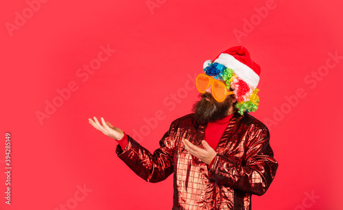 Funny man with beard. Winter holidays. Disco music. Warmest greetings this season. Bearded man celebrate christmas. Christmas party entertainment. Christmas spirit. Cheerful guy colorful hairstyle