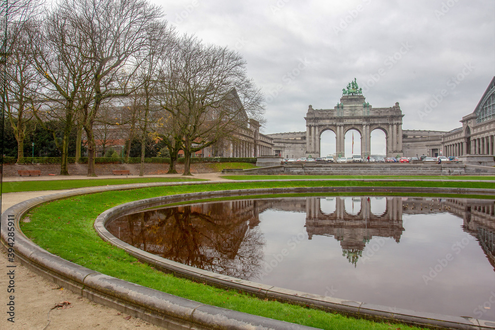 Arc de Triomphe in Sencantener Park  in Brusseles  and reflection in pond water   ( Auti Pavilion - at left corner)