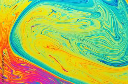 Psychedelic abstract formed by light refraction on the surface of a soap bubble