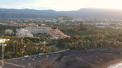 Drone shot panning around a rocky beach in the canary islands during sunset photo