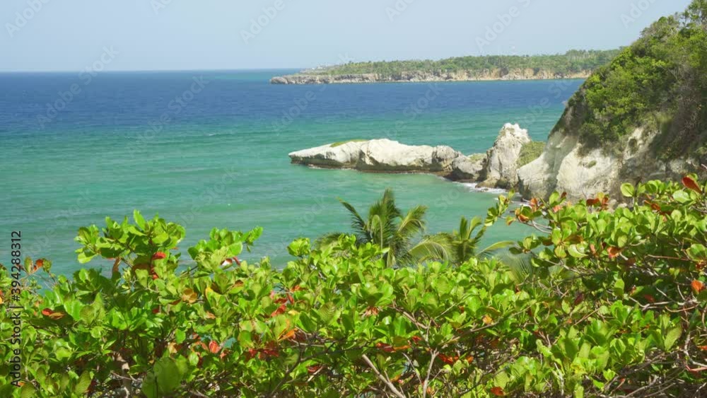 Incredible panorama from a hill overlooking a great cliff in the Caribbean, green vegetation, calm atmosphere, turquoise blue water Incredible panorama from a hill overlooking a great cliff in the Caribbean, green vegetation, calm atmosphere, turquoise blue water