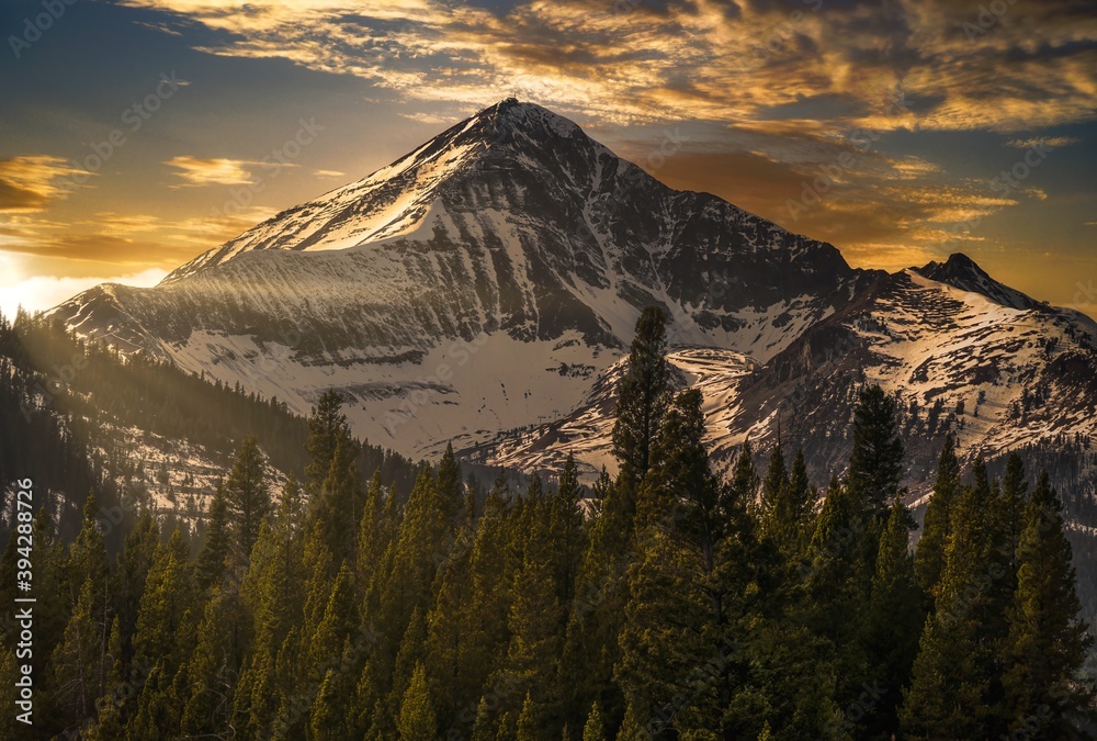 This image shows an epic winter mountainous landscape at Lone Peak in Big Sky, Montana. - obrazy, fototapety, plakaty 