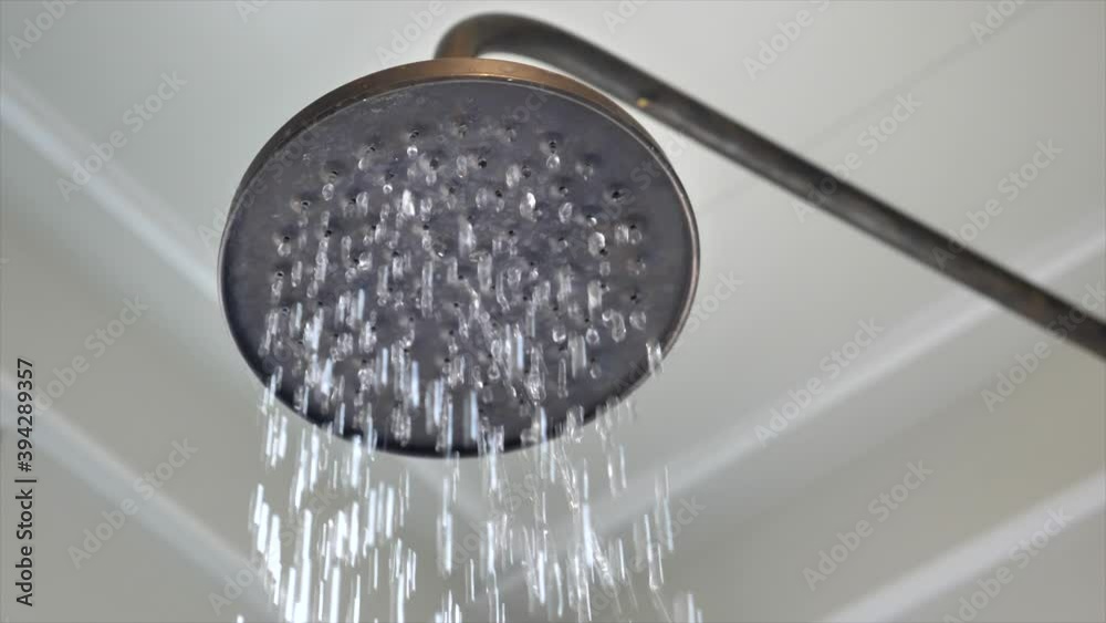 Close-up of water running from a shower head Close-up of water running from a shower head