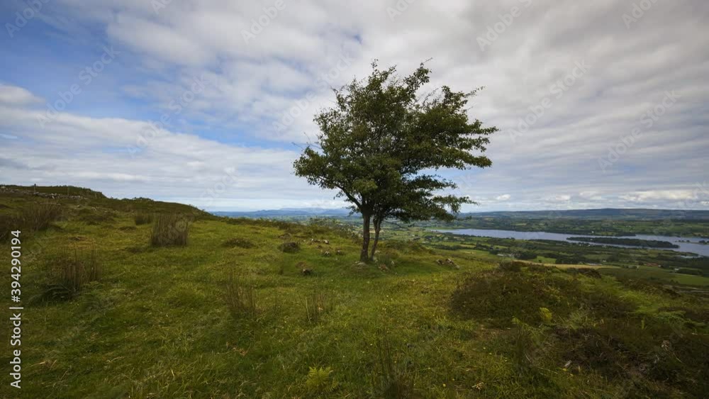 Time lapse of rural and remote landscape of grass, trees and rocks during the day in hills of Carrowkeel in county Sligo, Ireland. Time lapse of rural and remote landscape of grass, trees and rocks during the day in hills of Carrowkeel in county Sligo, Ireland.