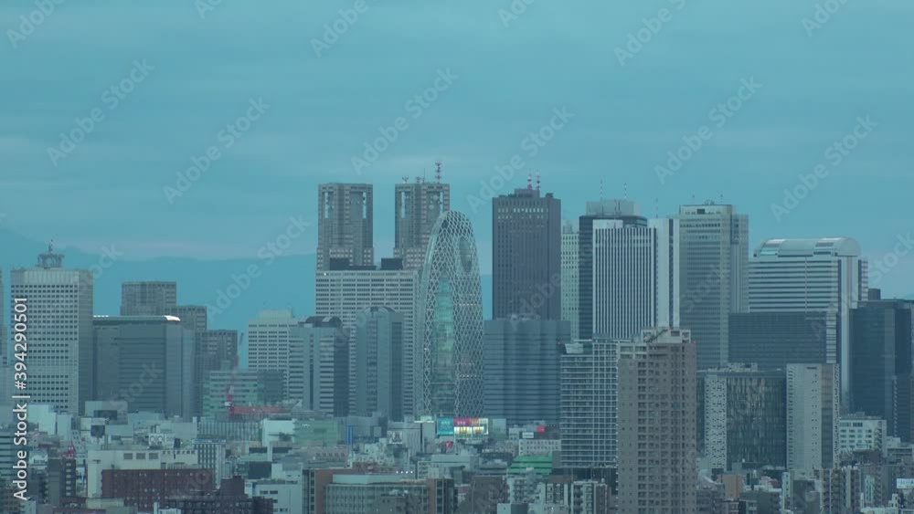 TOKYO, JAPAN : Aerial high angle sunset CITYSCAPE of TOKYO. View of buildings around Shinjuku. Japanese urban metropolis concept shot. Long time lapse shot dusk to night. Zoom in shot. TOKYO, JAPAN : Aerial high angle sunset CITYSCAPE of TOKYO. View of buildings around Shinjuku. Japanese urban metropolis concept shot. Long time lapse shot dusk to night. Zoom in shot.