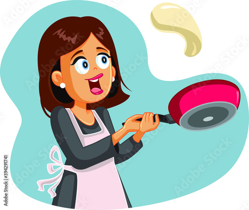 Happy Female Home Cook Flipping Pancake for Breakfast