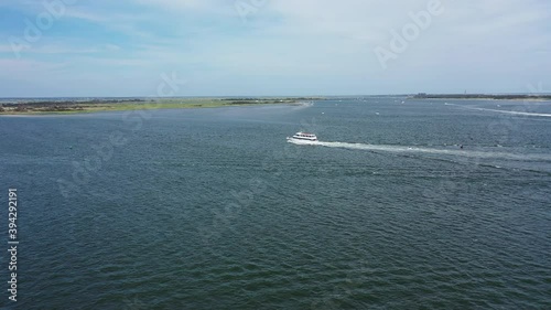 Wallpaper Mural An aerial drone view over Jones Inlet on a sunny day. The camera dolly in towards a tour boat, then pan left. The inlet is calm & peaceful. Torontodigital.ca