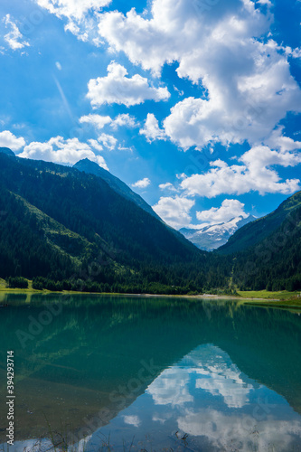 Durlassboden reservoir in the Zillertal Alps, mountain lake with reflection in austria © Martin