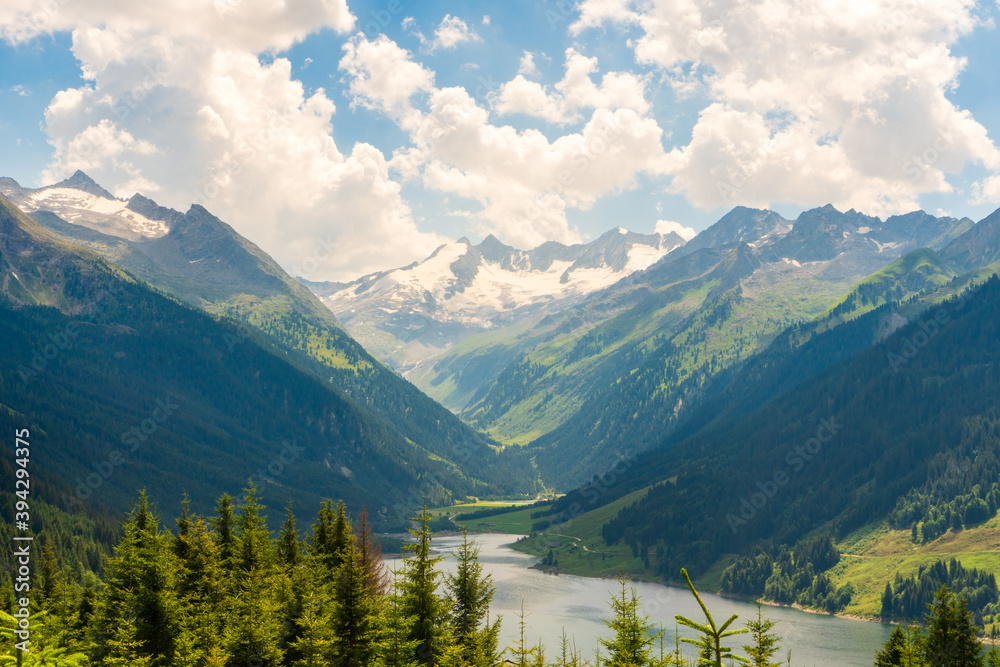 Durlassboden reservoir in the Zillertal Alps, mountain lake with reflection in austria Durlassboden reservoir in the Zillertal Alps, mountain lake with reflection in austria