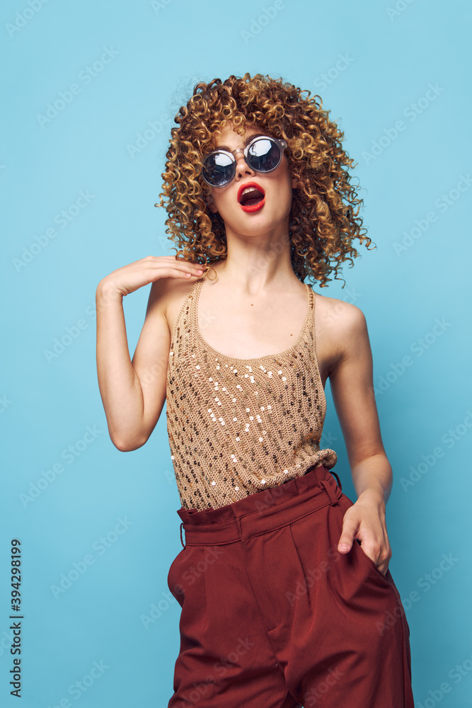 Cheerful woman Red lips curly hair trendy style blue background 