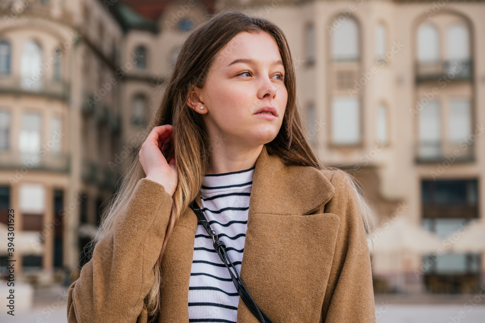 Fototapeta premium Beautiful young woman in winter clothes