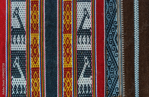 Andes textile with llama pattern on a local art and craft market, Cusco, Peru.