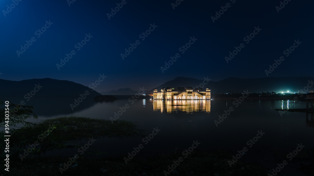 Illuminated night view of Jal Mahal 'Water Palace' is an architectural showcase of Rajput style in the Man Sagar lake in jaipur city, the capital of Rajasthan, India. Illuminated night view of Jal Mahal 'Water Palace' is an architectural showcase of Rajput style in the Man Sagar lake in jaipur city, the capital of Rajasthan, India.
