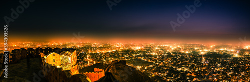 Panoramic aerial view of Jaipur city also known as Pink city during twilight from Nahargarh Fort  Rajasthan  India.