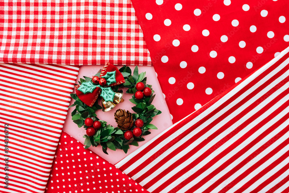 Fototapeta premium Christmas composition. Christmas red decorations, fir tree branches on red background. Flat lay, top view, copy space