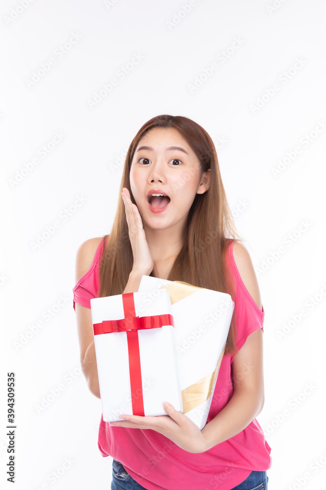 Attractive asian woman holding gift box in christmas, new year, valentine day, birthday celebration concept. Portrait of smiling happy pretty girl hold gift box on white background. Attractive asian woman holding gift box in christmas, new year, valentine day, birthday celebration concept. Portrait of smiling happy pretty girl hold gift box on white background.