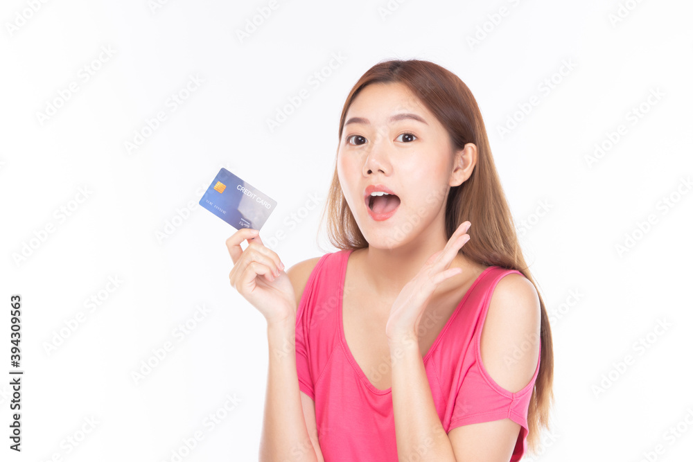 Portrait asian young girl happy and smile shopping online concept. Attractive beautiful asian young woman showing credit card for shopping online, payment on white background with copy space. Portrait asian young girl happy and smile shopping online concept. Attractive beautiful asian young woman showing credit card for shopping online, payment on white background with copy space.
