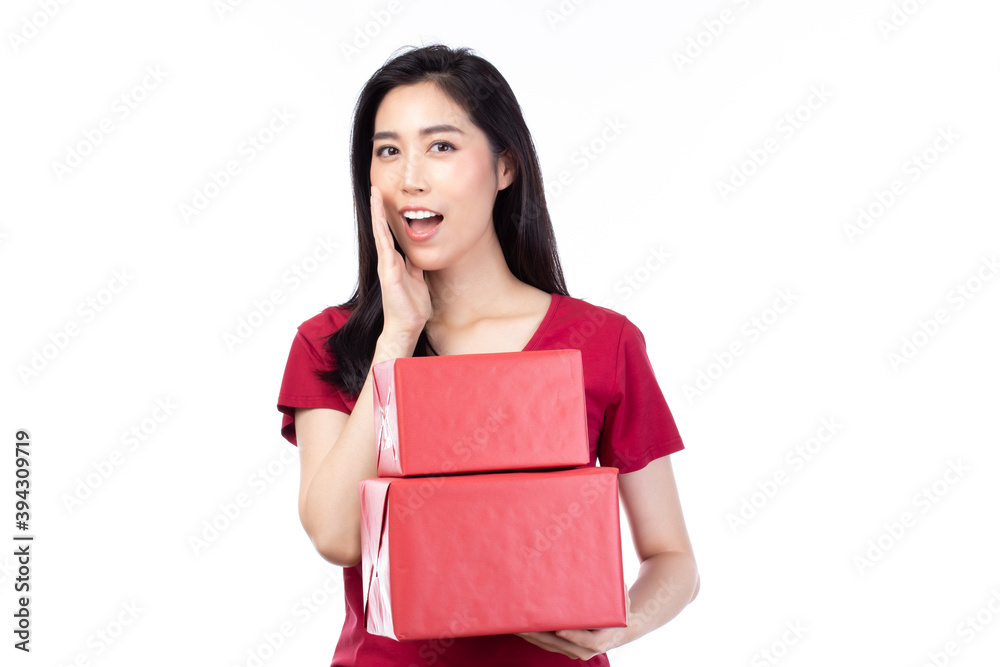 Happy pretty young woman holding gift box present in christmas or new year on white background. Happy pretty young woman holding gift box present in christmas or new year on white background.