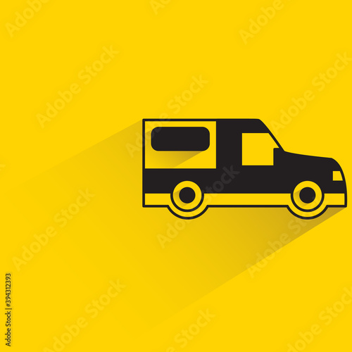 van with shadow on yellow background