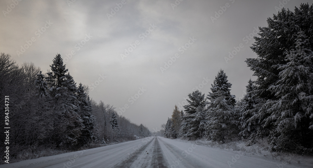 Winter snow storm and snow covered road in Upper Peninsula of Michigan. Winter snow storm and snow covered road in Upper Peninsula of Michigan.