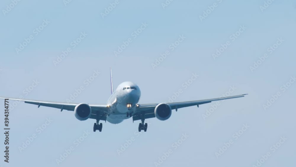 Airliner approaching the airport over ocean Airliner approaching the airport over ocean