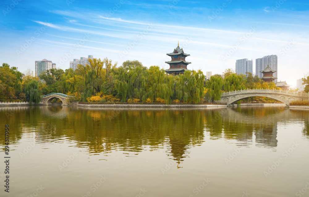 In autumn, ancient buildings and arch bridges are in Yingze Park, Taiyuan, Shanxi Province, China