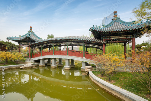 In autumn, ancient buildings and arch bridges are in Yingze Park, Taiyuan, Shanxi Province, China