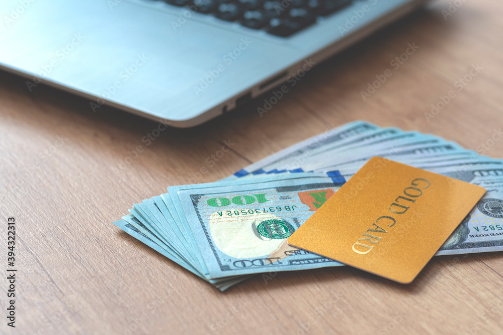 Blurred photo. Shopping card with money, dollars and notebook. Blurred photo. Shopping card with money, dollars and notebook.