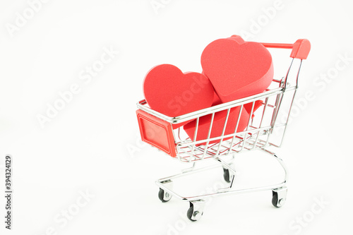 grocery cart and hearts inside, the concept of love by calculation