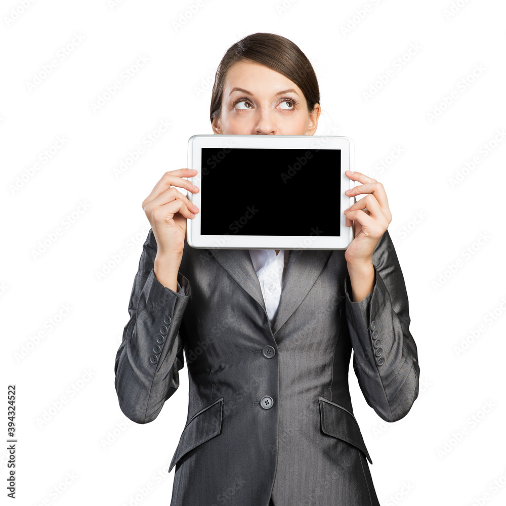 Businesswoman with tablet computer looking upwards