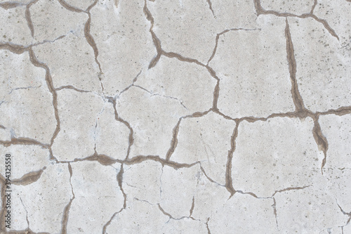 Background image of a gray wall with cracks.