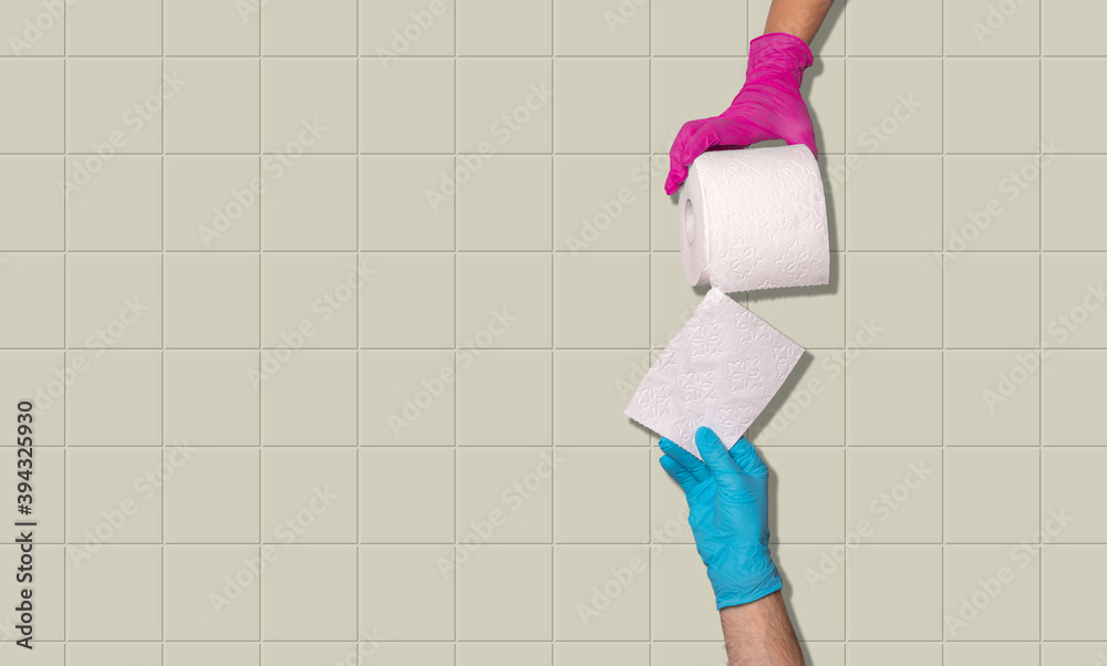 Female hand with magenta color sanitary glove holding a toilet paper