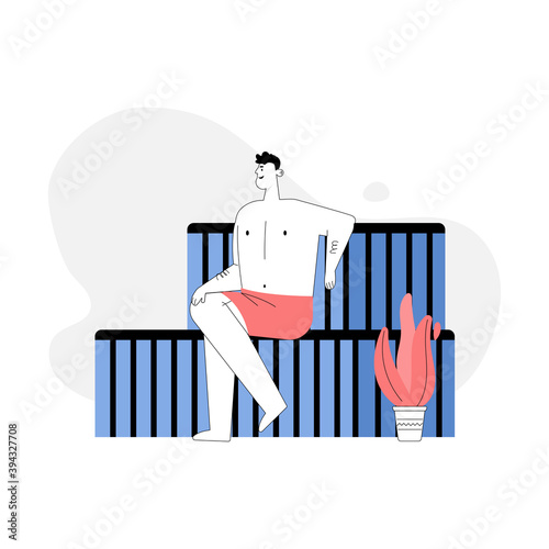 Man sitting on bench in steam room, bathing in sauna