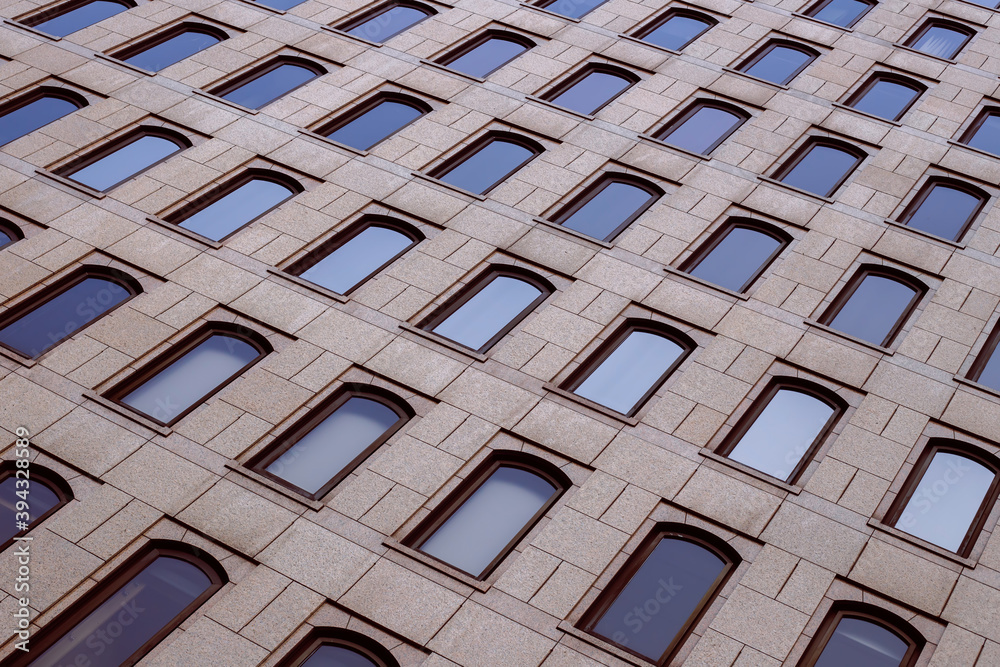 custom made wallpaper toronto digitalSeveral windows in a row on the facade of a modern building. Windows in a row on a marbled wall. Rows of windows on a high building. Toned image.