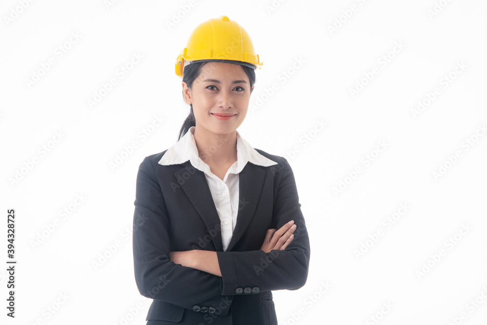 Young engineer woman wear black suit and yellow safety helmet with arm cross on isolated white background. Young engineer woman wear black suit and yellow safety helmet with arm cross on isolated white background.