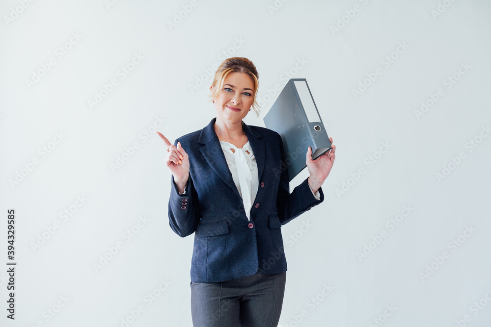 Beautiful business woman with paper folders in the business office