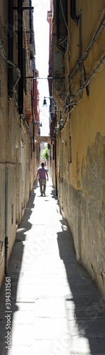 Narrow street called CALLE in Italian Language in Venice