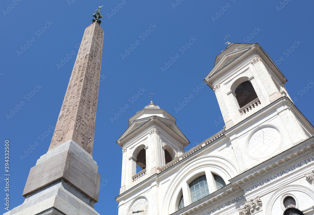 Egyptian obelisk and Trinity dei Monti church in Rome in Italy