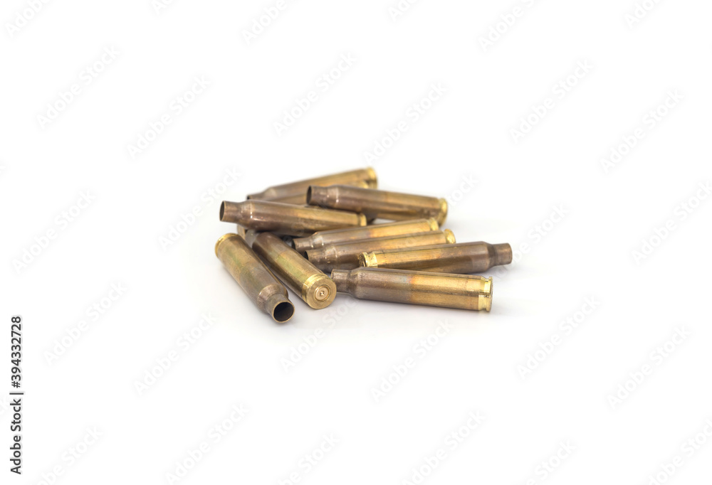 empty cases for carbine and rifle isolated on white background. Shooting ammunition, close-up. empty cases for carbine and rifle isolated on white background. Shooting ammunition, close-up.