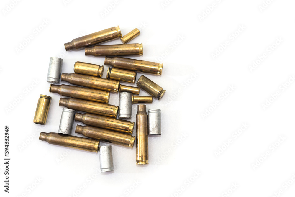empty cases for carbine and rifle isolated on white background. Shooting ammunition, close-up. empty cases for carbine and rifle isolated on white background. Shooting ammunition, close-up.