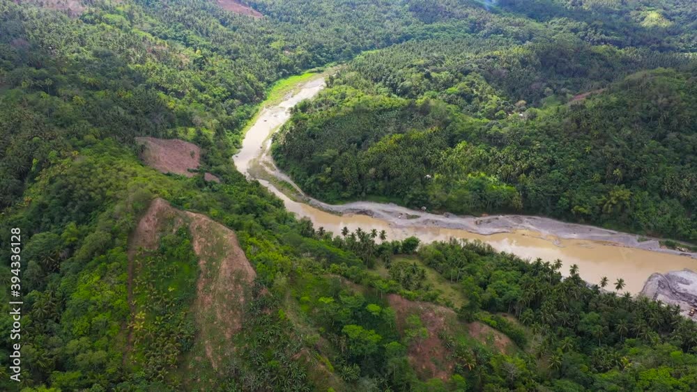 Aerial view of River in the mountains among the rainforest. Mindanao, Philippines. Aerial view of River in the mountains among the rainforest. Mindanao, Philippines.