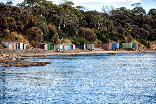 Old boatsheds on the shoreline at Opposum Bay along the Derwent River