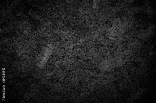Dark tone granite surface. Intrusive igneous rock. photo