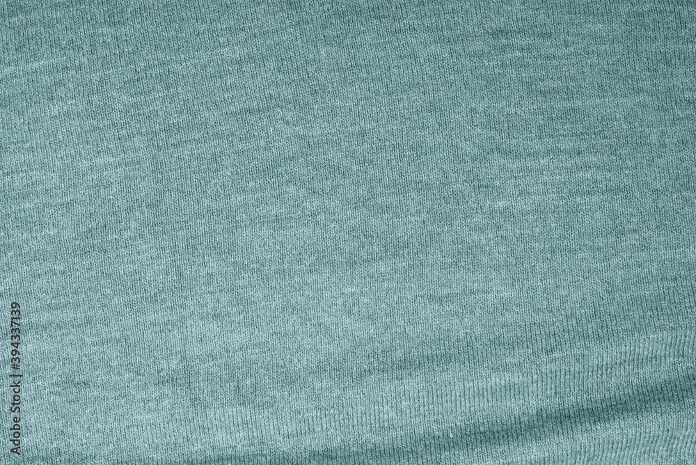 Close up of green knitted textured background. Close up of green knitted textured background.