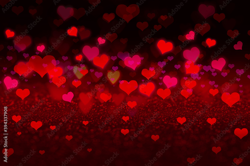 Beautiful heart shaped lights on color background, blurred view. Valentine's day