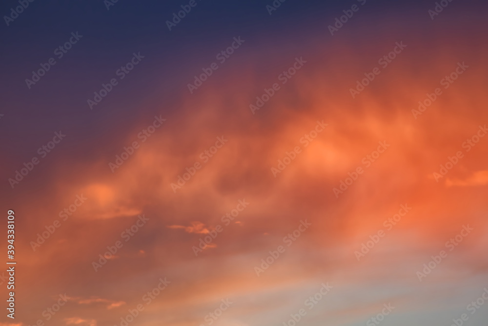 A purple golden night sky with clouds