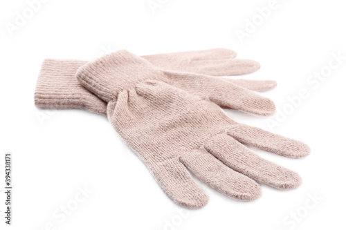 Pink woolen gloves on white background. Winter clothes