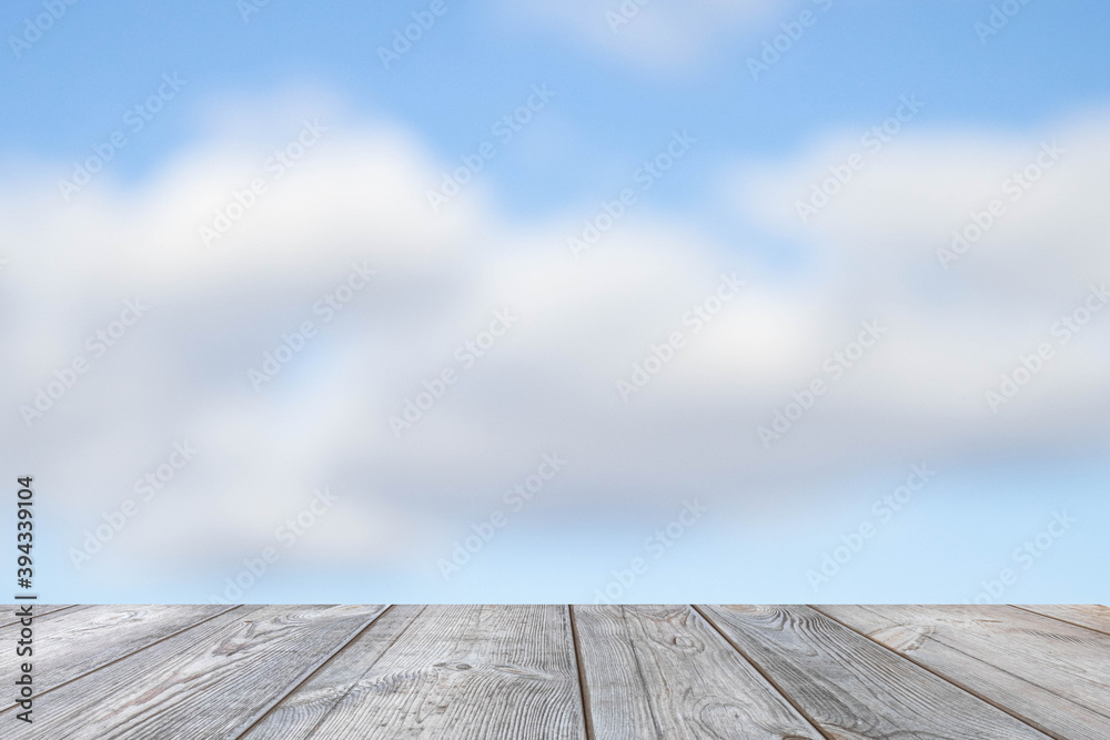 Blurred background of blue sky over the table.